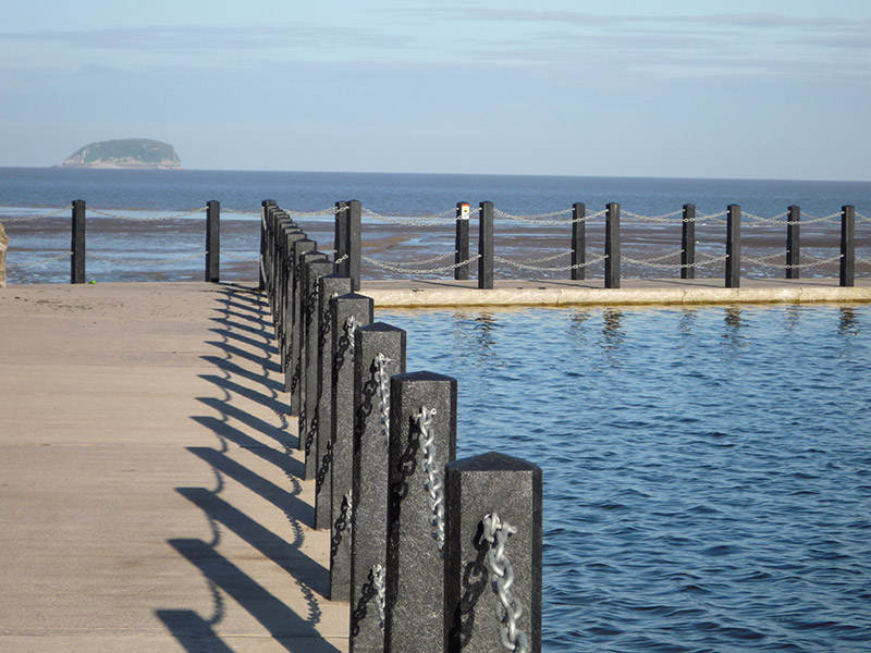 recycled plastic bollards from kedel on sea waterfront